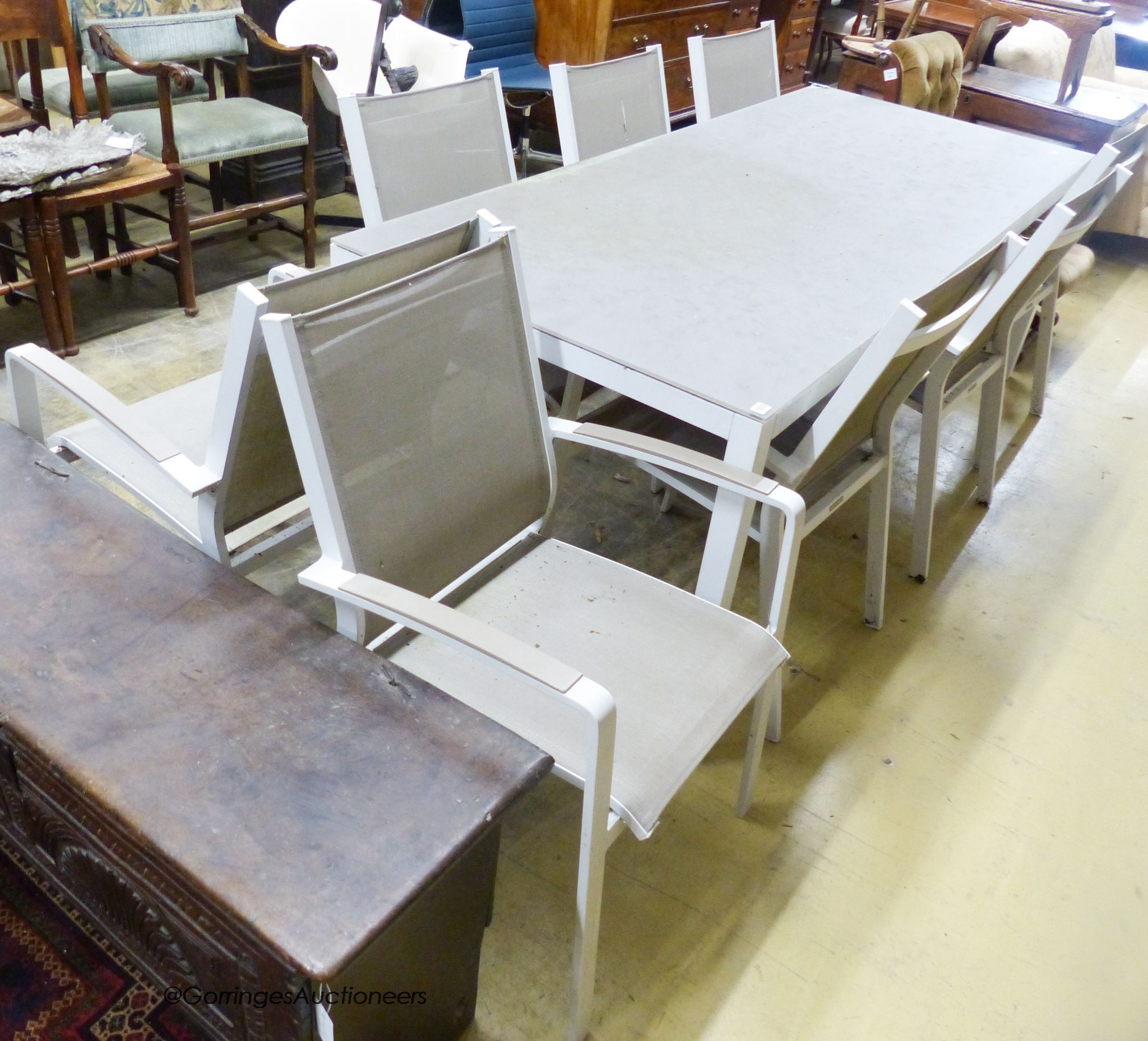 A modern Westminster Furniture aluminium and glass rectangular garden table, width 220cm, depth 92cm, height 75cm and eight chairs
